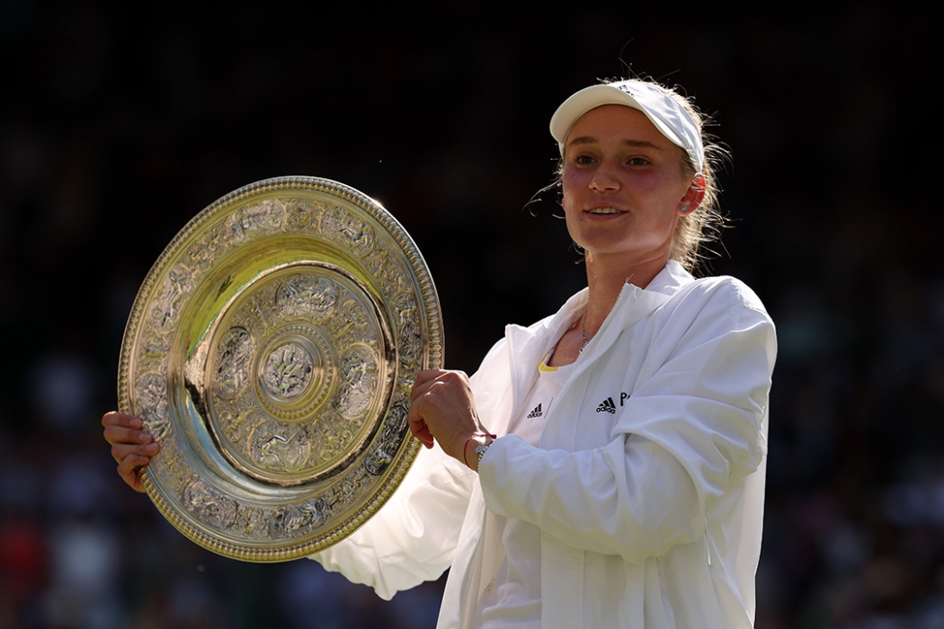 Elena Rybakina celebrates with the trophy after winning the 2022 Wimbledon title