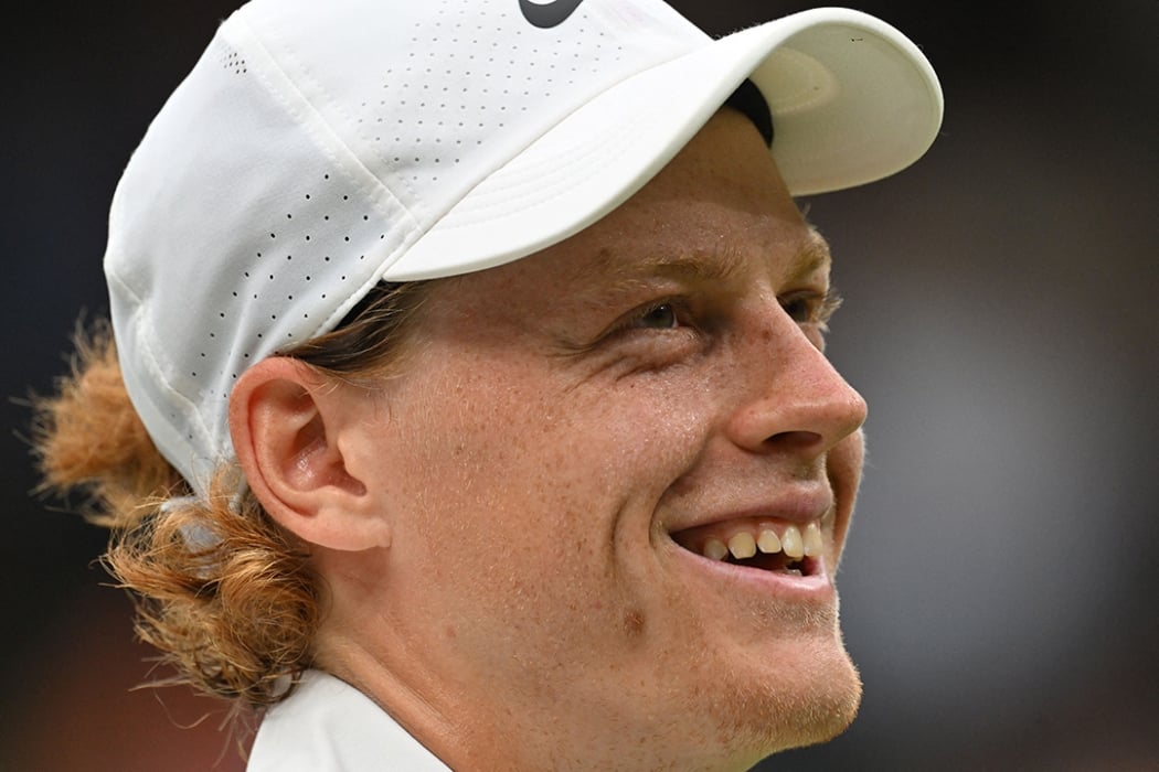 Jannik Sinner celebrates winning his Wimbledon quarterfinal over Roman Safiullin