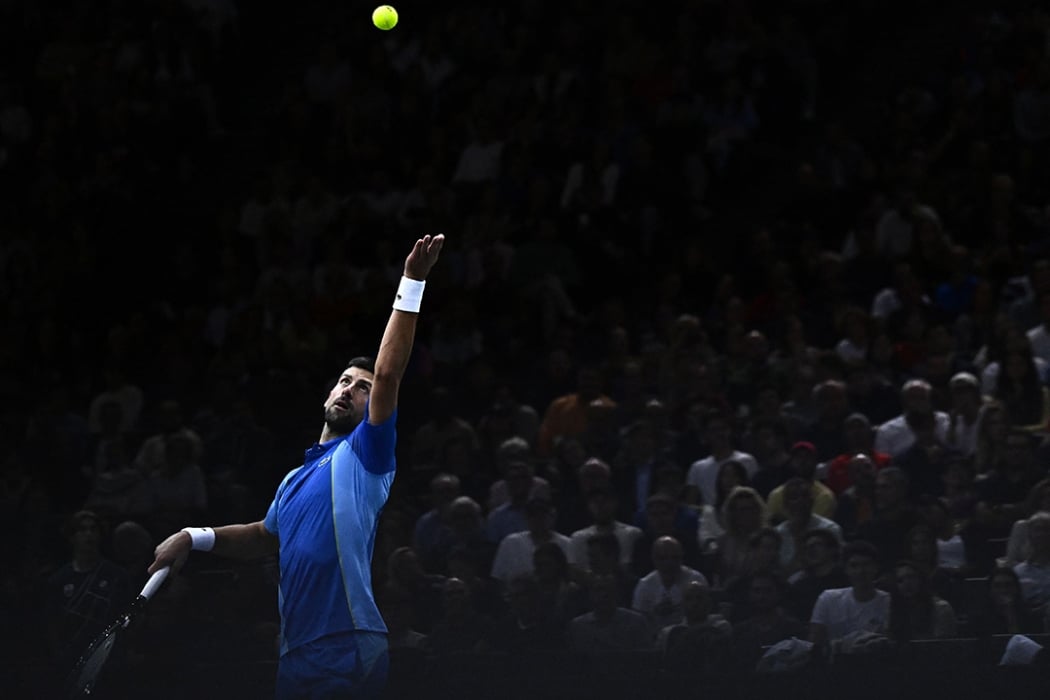 Novak Djokovic serves at the Paris Masters, which he won for his 40th Masters 1000 crown and 97th career title
