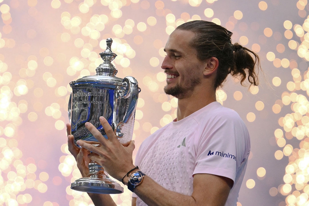 Alexander Zverev holds the champion's trophy at the US Open