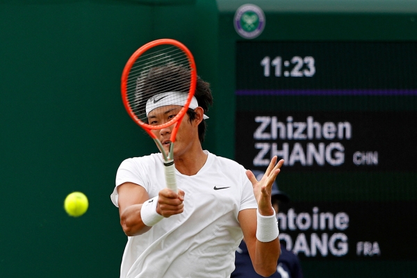 Zhang Zhizhen in action during his Grand Slam main-draw debut at Wimbledon 2021