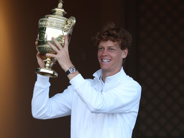 Jannik Sinner celebrates his first Wimbledon title after beating Carlos Alcaraz in the final